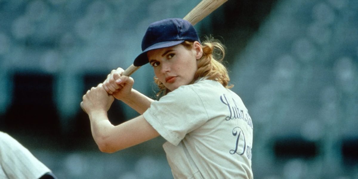Geena Davis playing baseball.