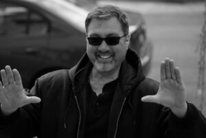 Interview: Tommy Burke on His Book ‘Not Just Sunglasses and Autographs,’ Working on ‘Chicago P.D.’, and More Tommy Burke Photo (1) black and white