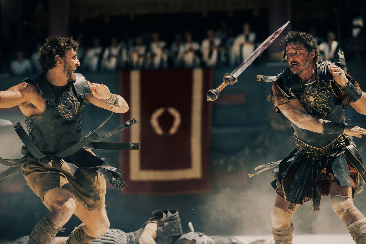 Paul Mescal and Pedro Pascal fighting in the arena