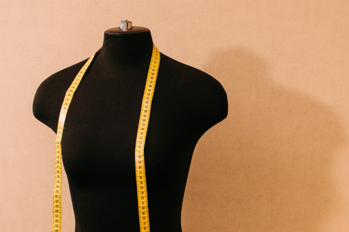 NYFW: These Designers Refuse to Back Down from Beauty Standards fashion mannequin with tape measure