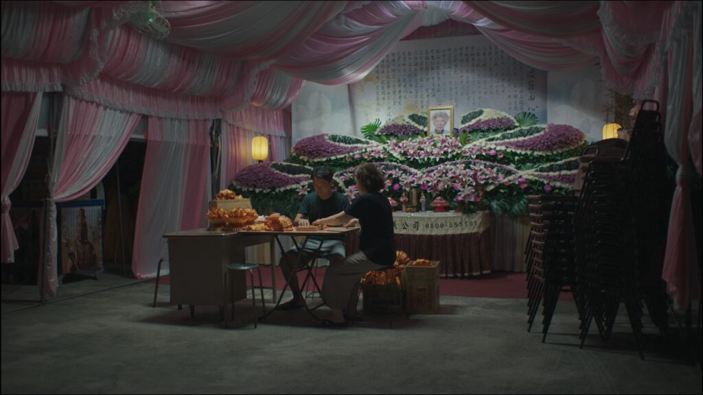 YuHan Tsai Discusses Her Short, DUA JI, Premiering at SXSW Brother and Big Sis sitting at a table talking.