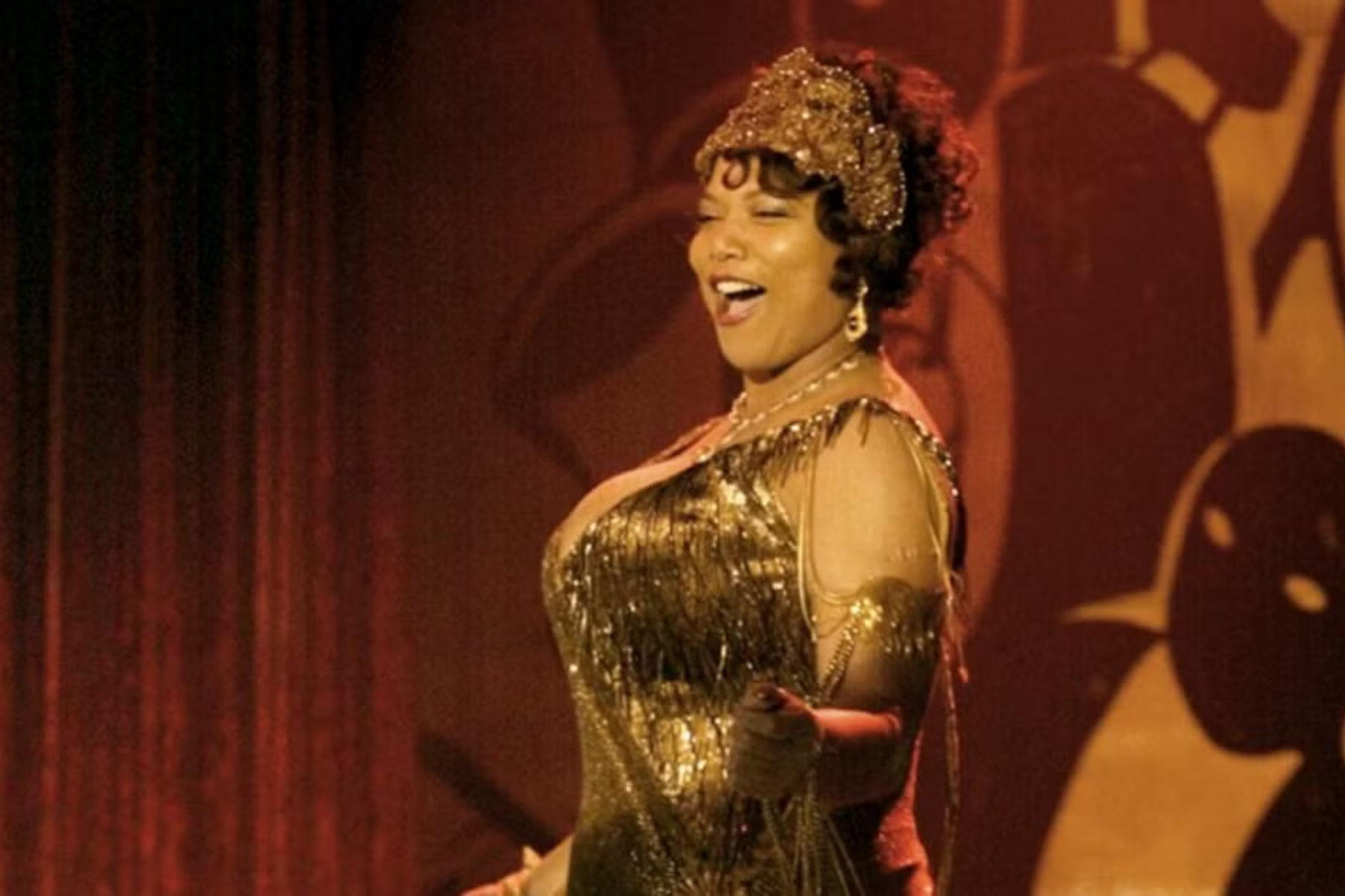 Queen Latifah as Mama Morton performing on stage in Chicago musical film