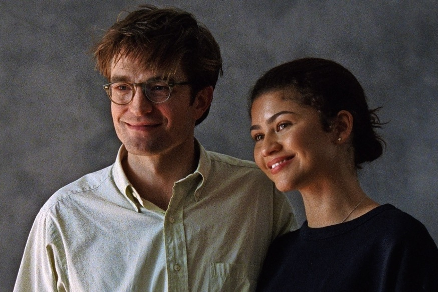 Zendaya as Emma and Robert Pattinson as Charlie in The Drama. (Photo courtesy of A24). Robert Pattinson and Zendaya smile together, appearing relaxed and happy