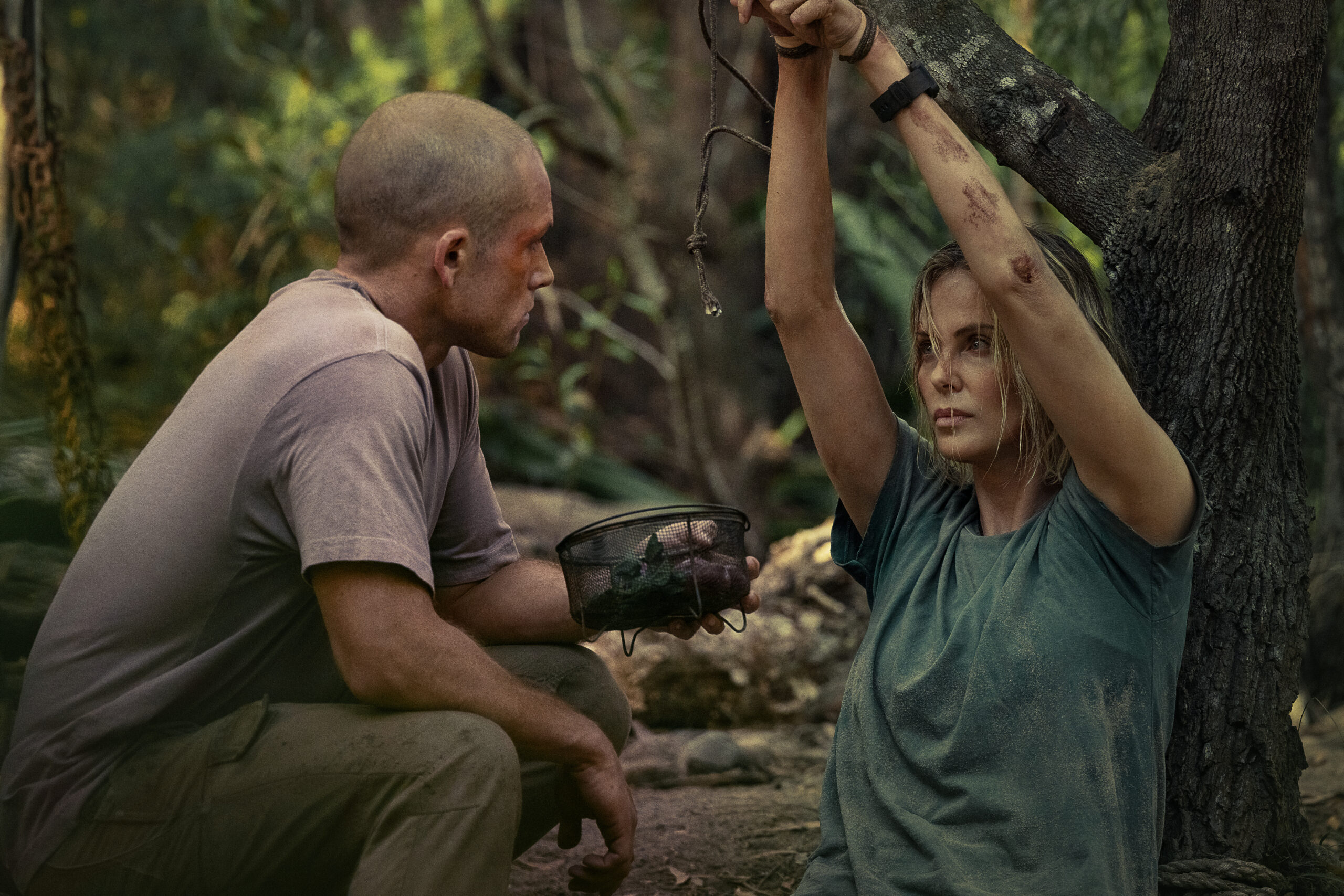 Taron Egerton as Ben and Charlize Theron as Sasha in APEX. 