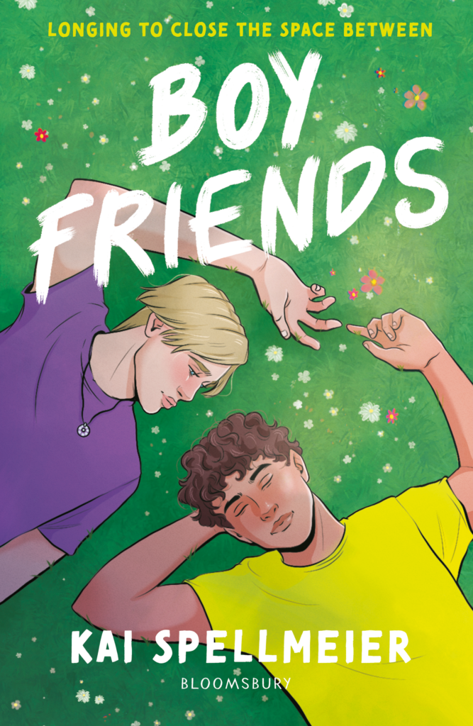 7 New LGBTQIA Books to Keep You Company This May: That Which Feeds Us, Girls Like Us, and more Book cover for'Boy Friends' showing three friends lying on green grass, holding hands, with bold white title text across the image and a yellow subtitle at the top.