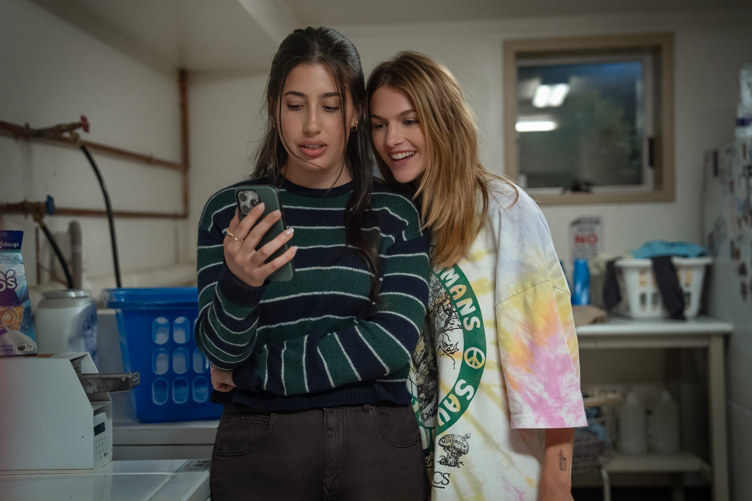 Roommates Movie Review: The Terrific Chloe East Can’t Salvage a Mean-Spirited Netflix Comedy ROOMMATES. (L to R) Sadie Sandler as Devon and Chloe East as Celeste in Roommates. Cr. Scott Yamano/Netflix © 2026.