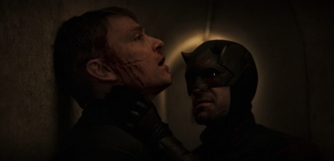 Daredevil: Born Again Season 2 Episode 5 Review: ‘The Grand Design’ Is A Greater Metaphor Batman pins a man against a wall in a dark hallway, gripping his neck as the man’s face shows a bloody cut.