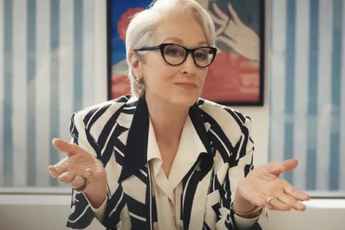 Miranda Priestly gestures while speaking during a serious conversation