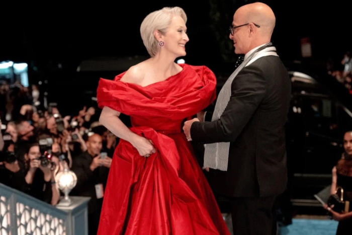 Miranda Priestly and Nigel share a moment together at a glamorous evening event