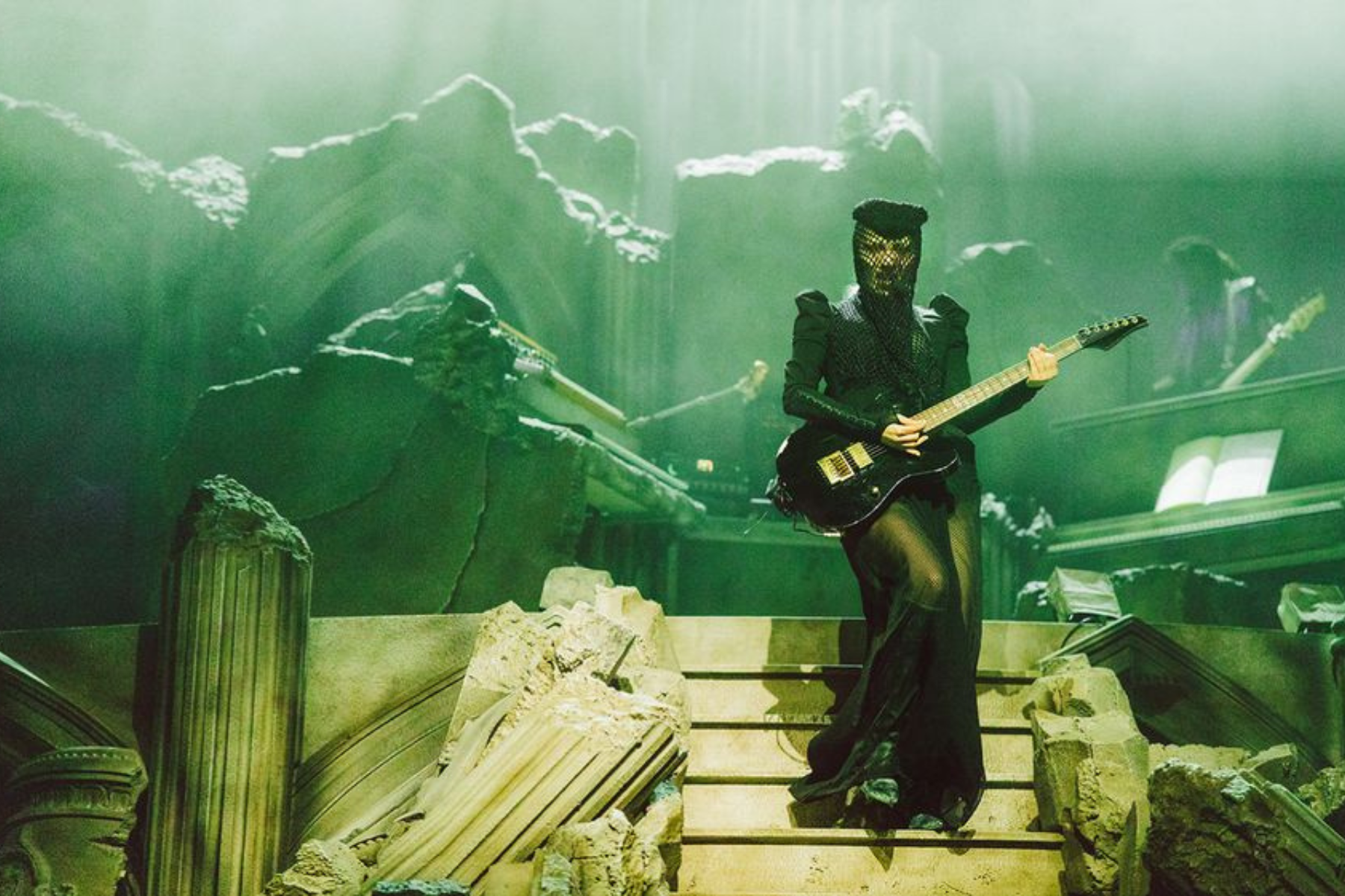 Lady Gaga Performs Guitar Set During MAYHEM Requiem - Eulalie Magazine Lady Gaga MAYHEM Requiem Review: Visually Stunning, Vocally Flawless Lady Gaga plays guitar on a staircase surrounded by ruined stone columns during MAYHEM Requiem