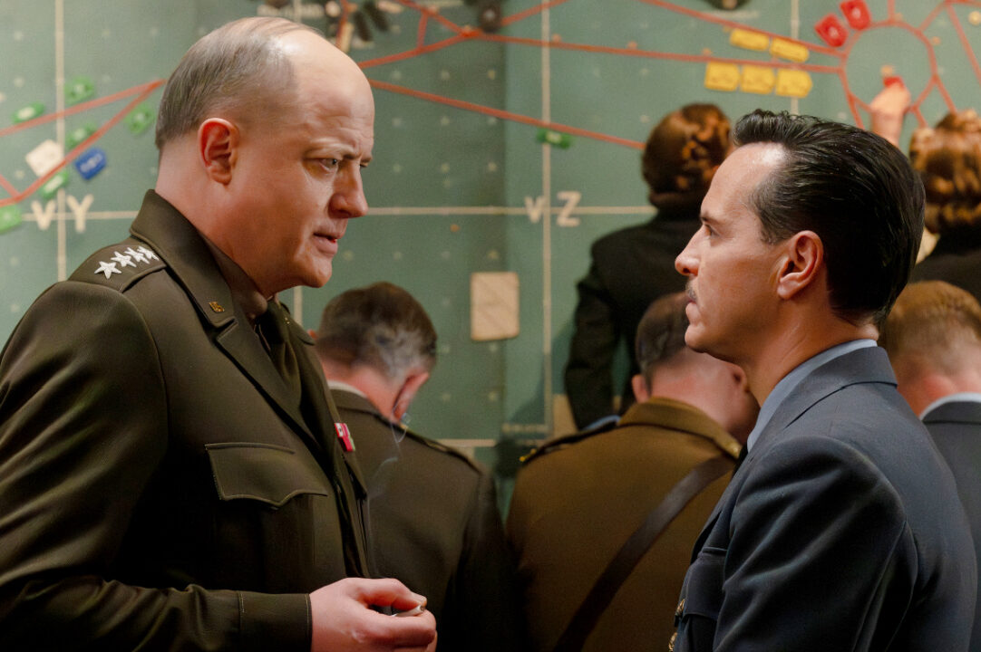 Pressure Review: Brendan Fraser and Andrew Scott are in Top Form for Powerful WWII Drama Two military officers in uniform converse in front of a large wall map.