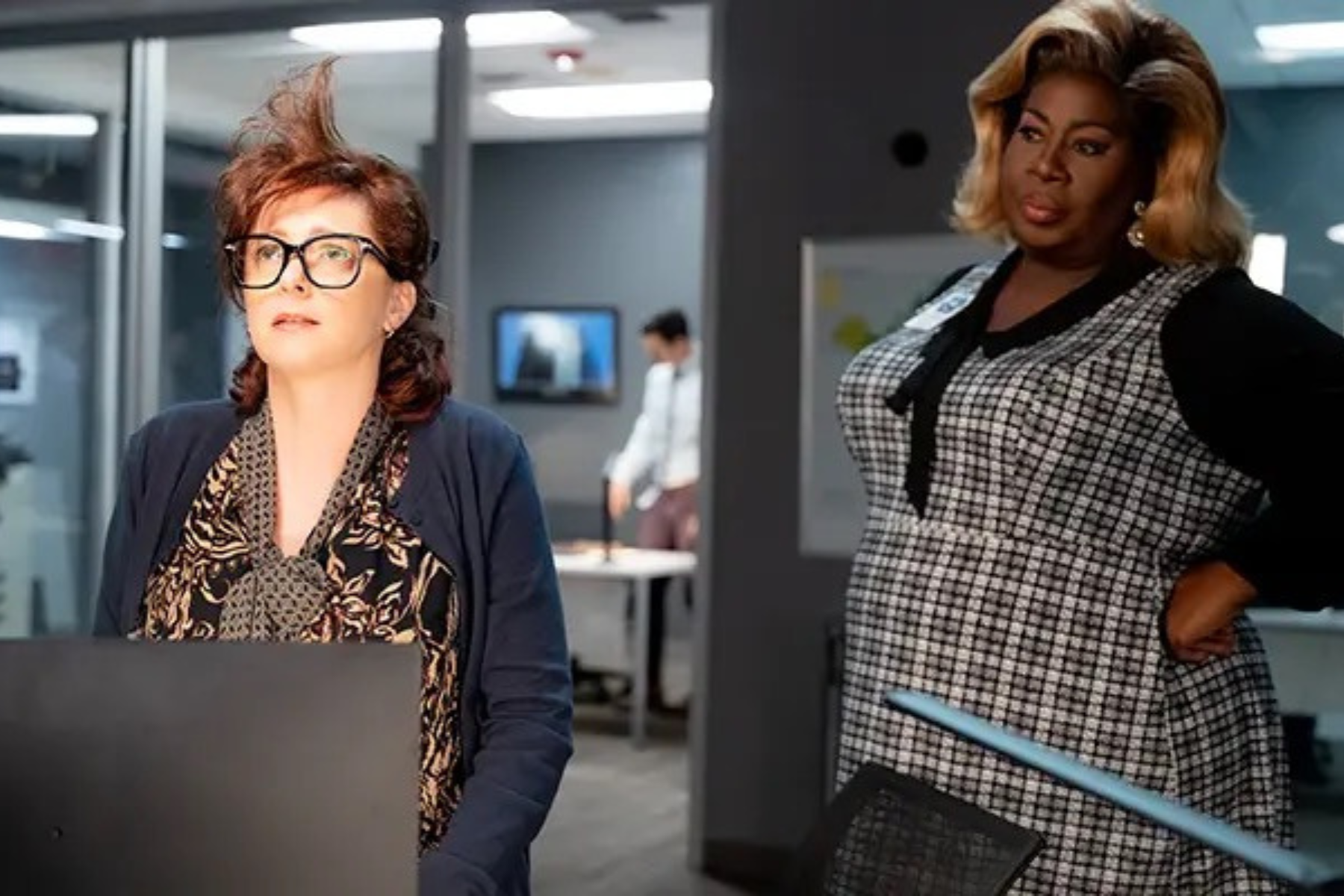 Donna Dusk Monitors the Stormaganza - Eulalie Magazine Stop! That! Train! Review: A First-Class Campy Comedy Donna Dusk stands beside a colleague in a control center as they monitor the dangerous weather event approaching the train.