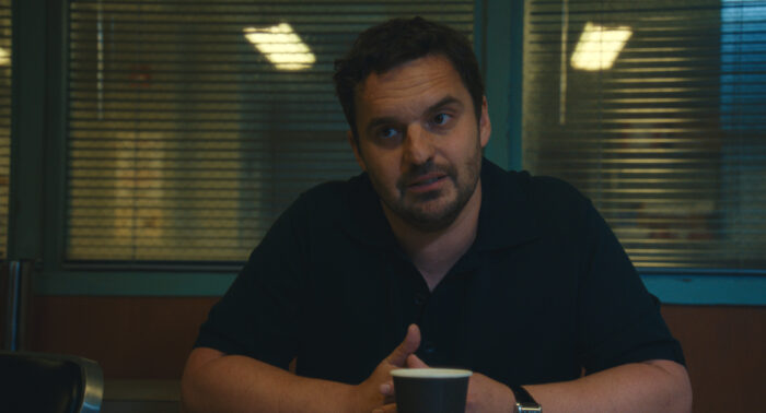 Maximum_Pleasure_Guaranteed_Photo_010503 - Eulalie Magazine Maximum Pleasure Guaranteed Season 1 Episode 5 Review: Scamboy Jake Johnson in "Maximum Pleasure Guaranteed," now streaming on Apple TV.