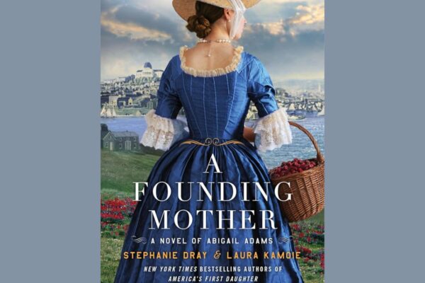 Back view of a woman in an 18th‑century blue gown with lace sleeves, holding a cherry basket, with a coastal town in the distance; cover for 'A Founding Mother'.”,