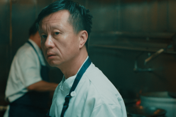 Close up of a man in a restaurant kitchen.