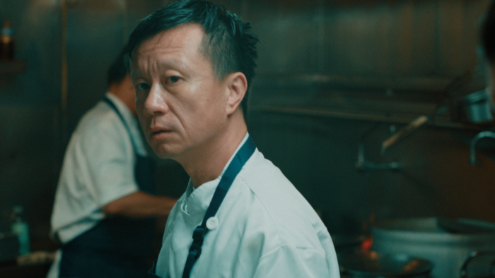 Benny Chen Discusses His Short, HAND Close up of a man in a restaurant kitchen.
