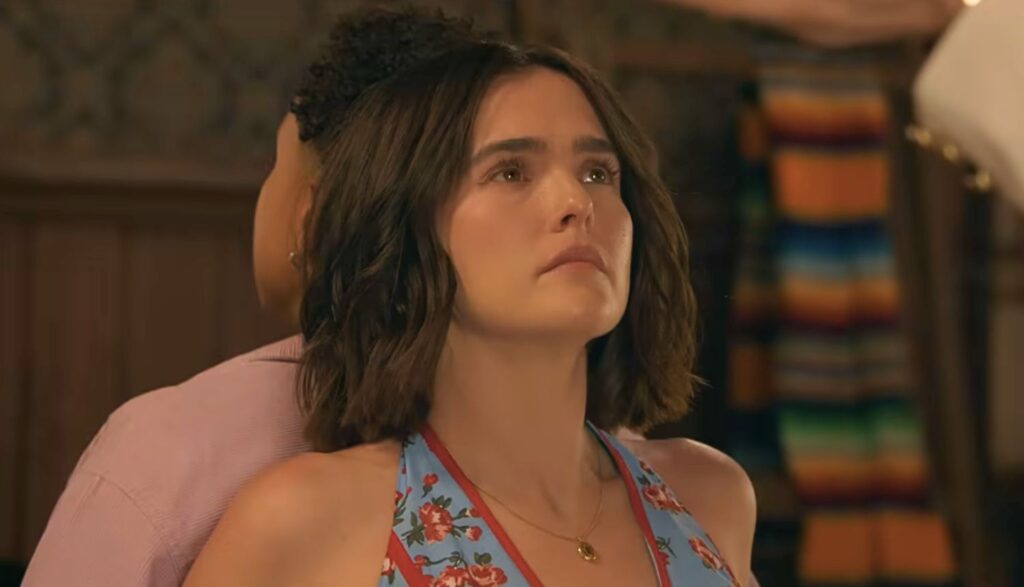 Gail Daughtry and the Celebrity Sex Pass Review: A Clever, Good Time with Wild Vibes and Offbeat Situations Woman with short brown hair sits with a calm, upward gaze as someone supports her head during a spa-like moment.