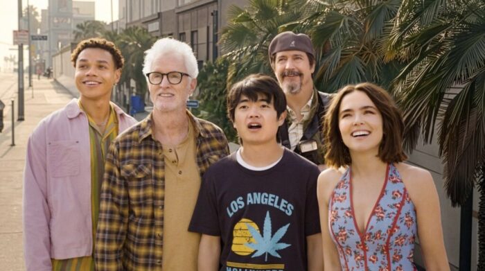 Gail Daughtry and the Celebrity Sex Pass Review: A Clever, Good Time with Wild Vibes and Offbeat Situations Five friends of varying ages walk along a sunny city sidewalk, smiling and looking up, with palm trees and storefronts in the background.