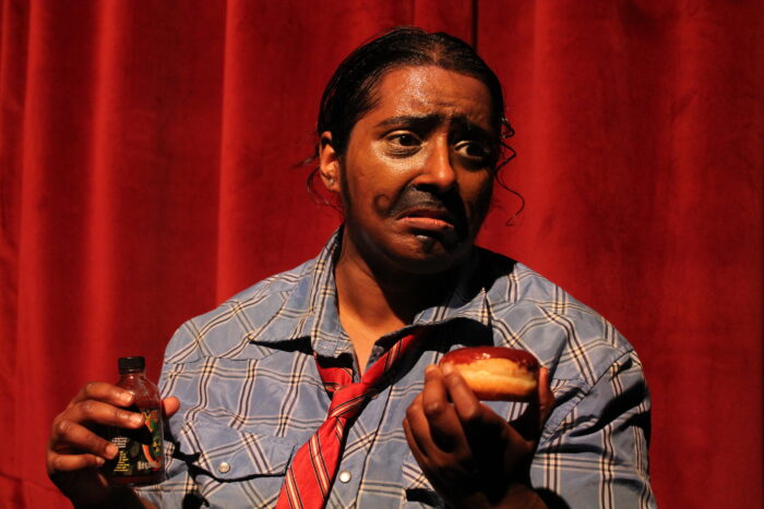 Srutika Sabu Interview: 1 Santosh Santosh 2 Go Artist Srutika Sabu is dressed as her character Santosh Santosh on stage.