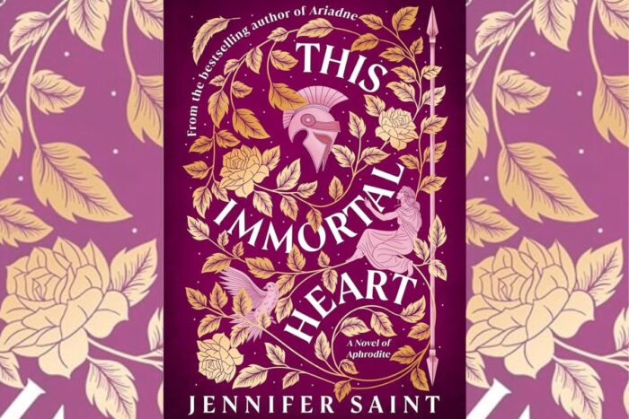 ‘This Immortal Heart’ Review: A Romantasy-infused Retelling Book cover for 'This Immortal Heart' by Jennifer Saint, featuring a purple background with gold vines and roses, a knightly helmet motif, and the subtitle 'A Novel of Aphrodite'.