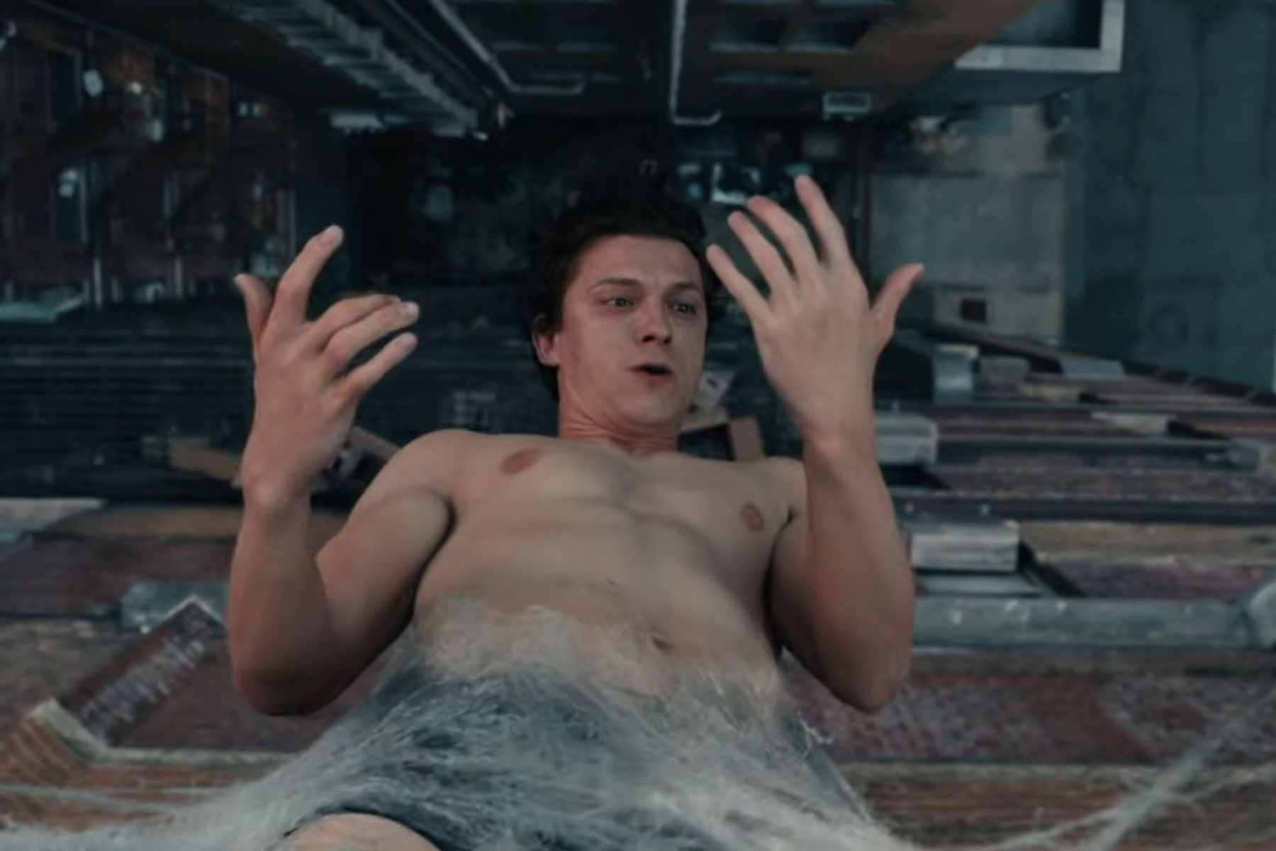 Spider-Man: Brand New Day Review: The Hero Marvel Needed Shirtless man floating in icy water, arms raised in a dim industrial setting, conveying distress or danger.