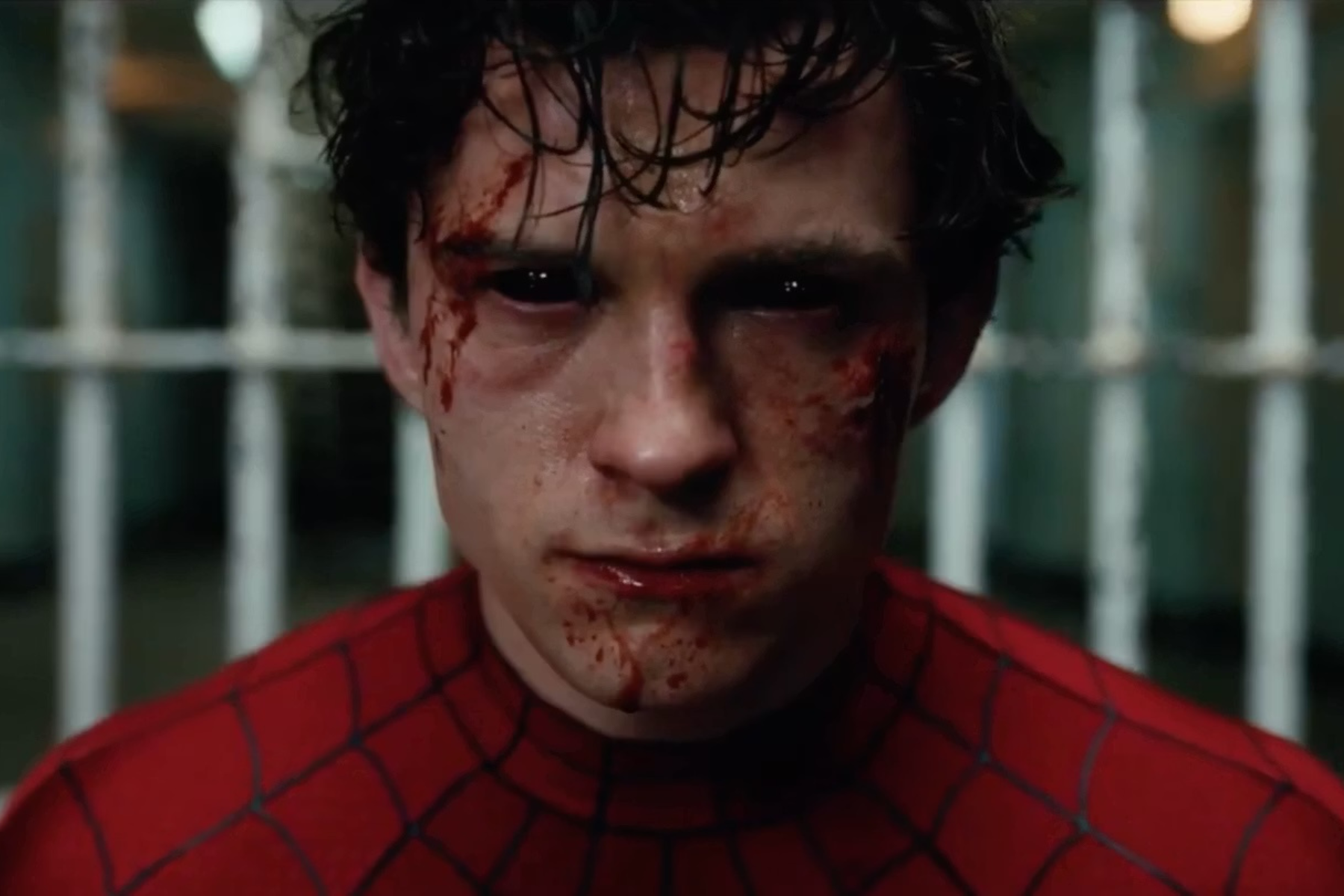 Spider-Man: Brand New Day Review: The Hero Marvel Needed Close-up of a blood-splattered face in a red Spider-Man suit, with blurred bars in the background.