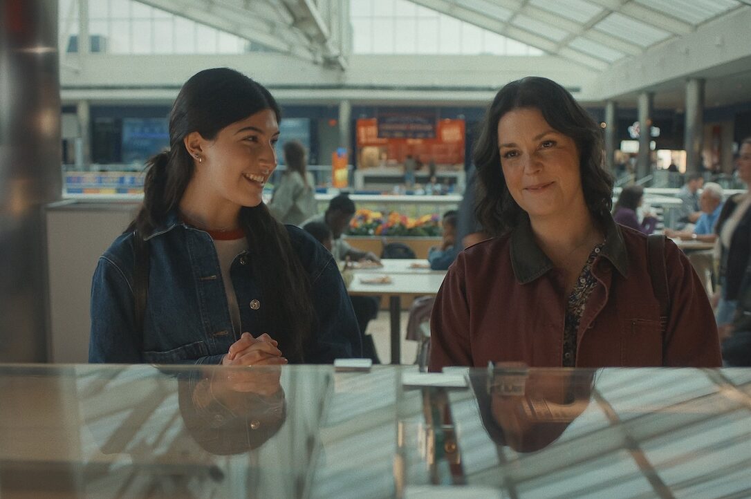Don’t Say Good Luck Review: Sunny Sandler is Solid Gold in This Slice of Life Drama Don't Say Good Luck film still - Sunny Sandler as Sophie and Melanie Lynskey as Elizabeth in Don’t Say Good Luck. Cr. Courtesy of Netflix © 2026.