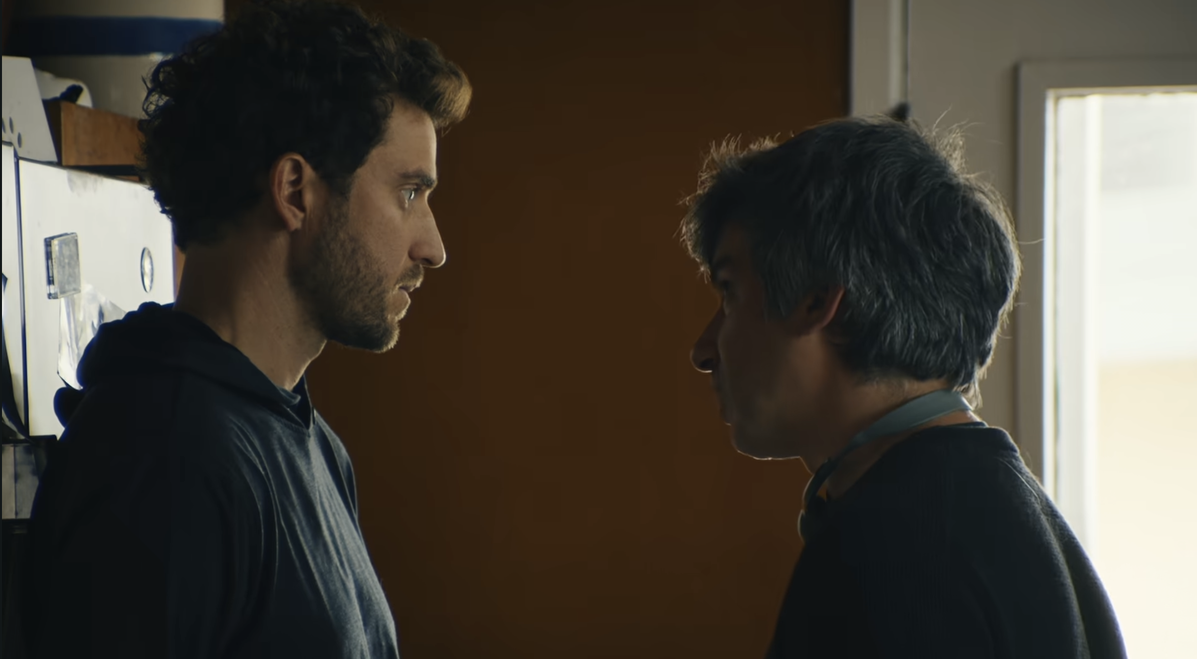 You Can See Everything Review: The Truth Is Not As Simple As It Seems Two men staring at each other in the kitchen